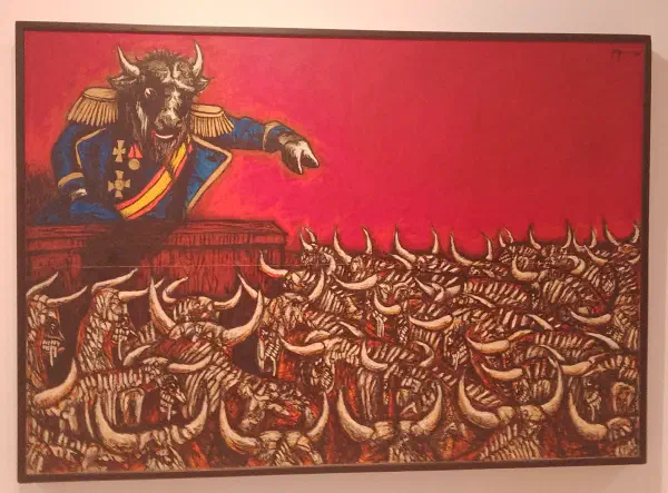 A bull wearing ceremonial military uniform delivers a speech to a crowd of other bulls as the sky burns red