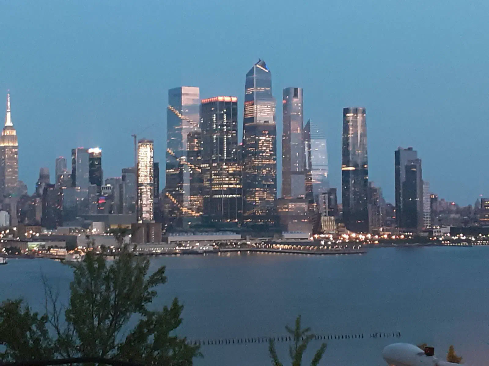 The New York City skyline at night, seen from across the Hudson