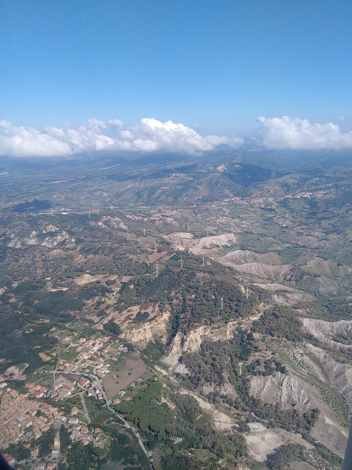 The hills of Calabria through the window of a plane