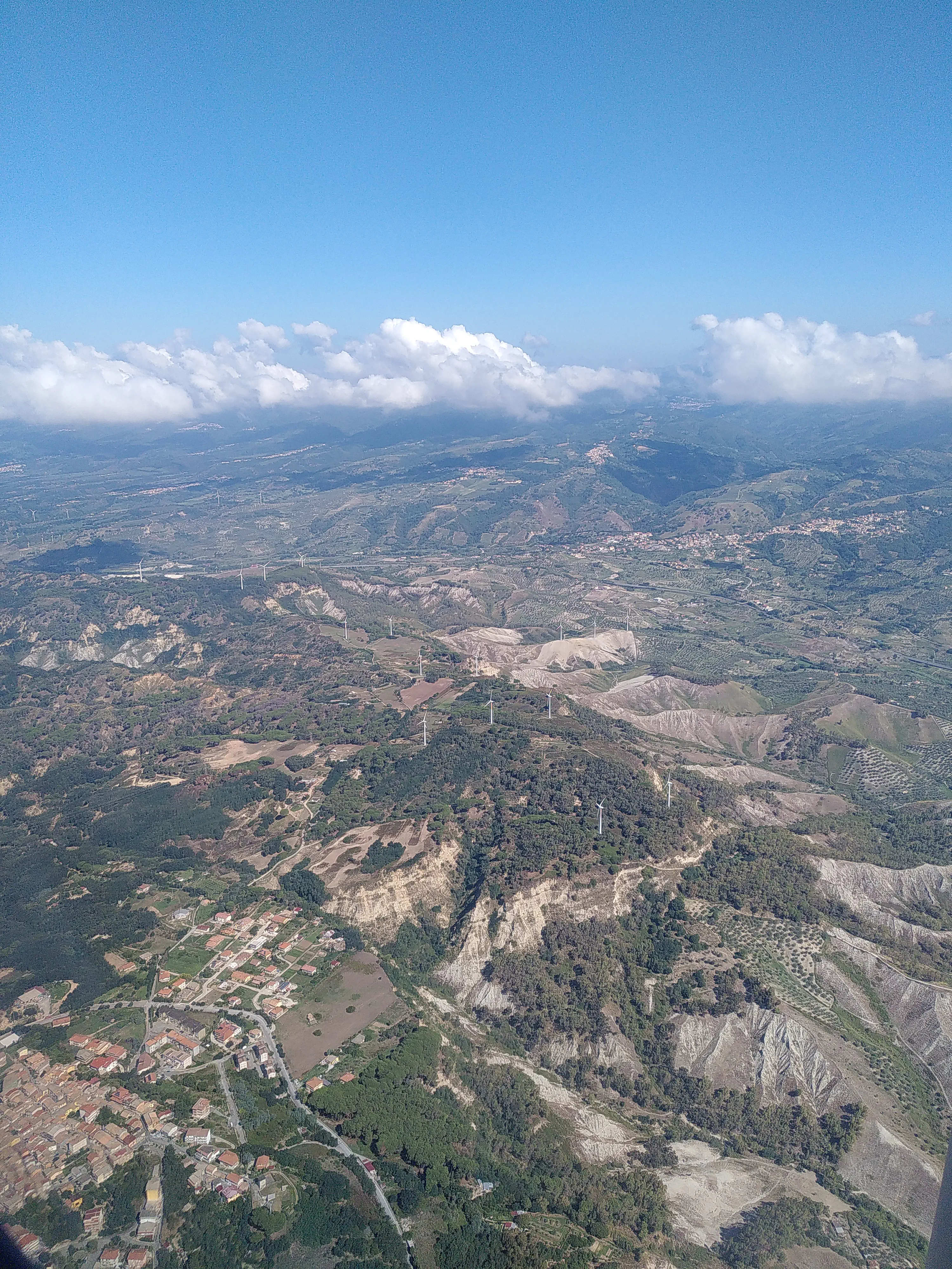 The hills of Calabria through the window of a plane