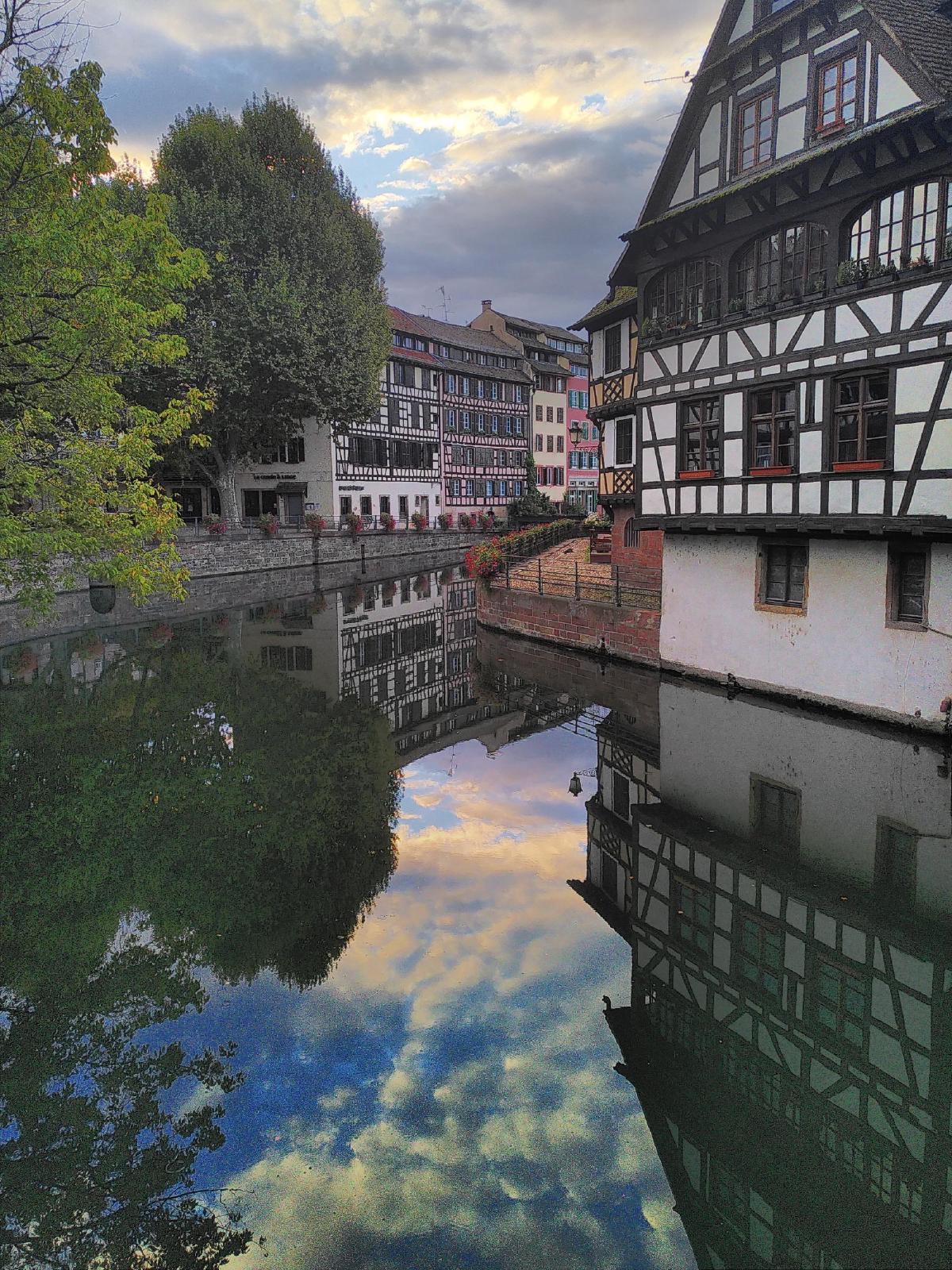 A canal and an old-style wooden house