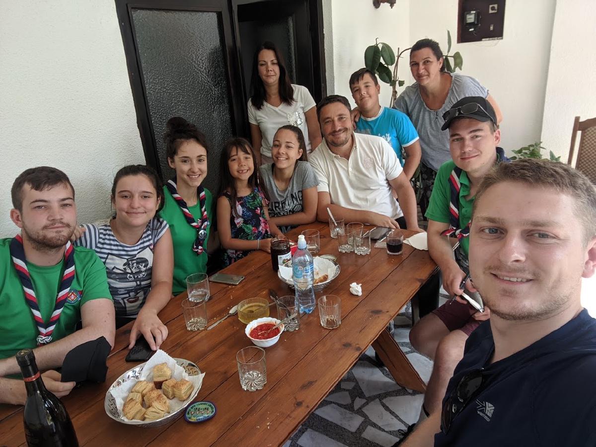 A group of people arranged around a dining table