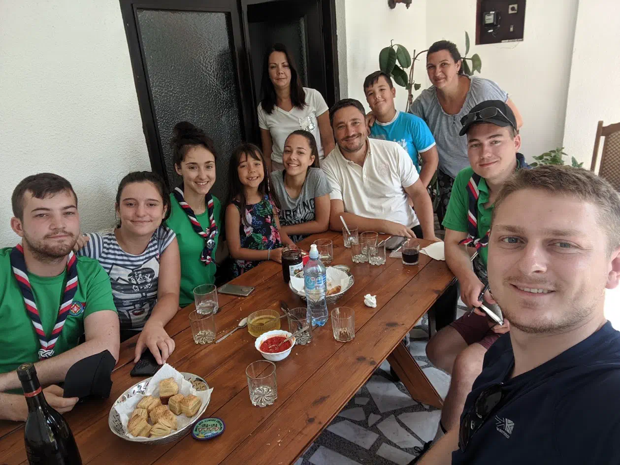 A group of people arranged around a dining table