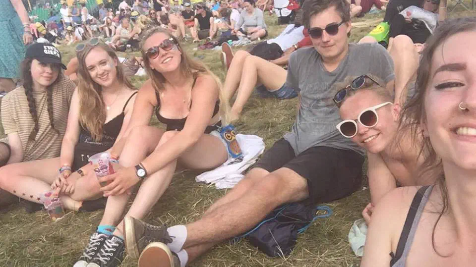 Me and friends sitting on the grass