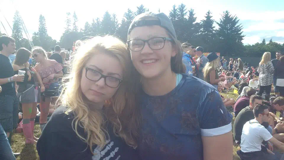 Two girls posing in a festival campsite