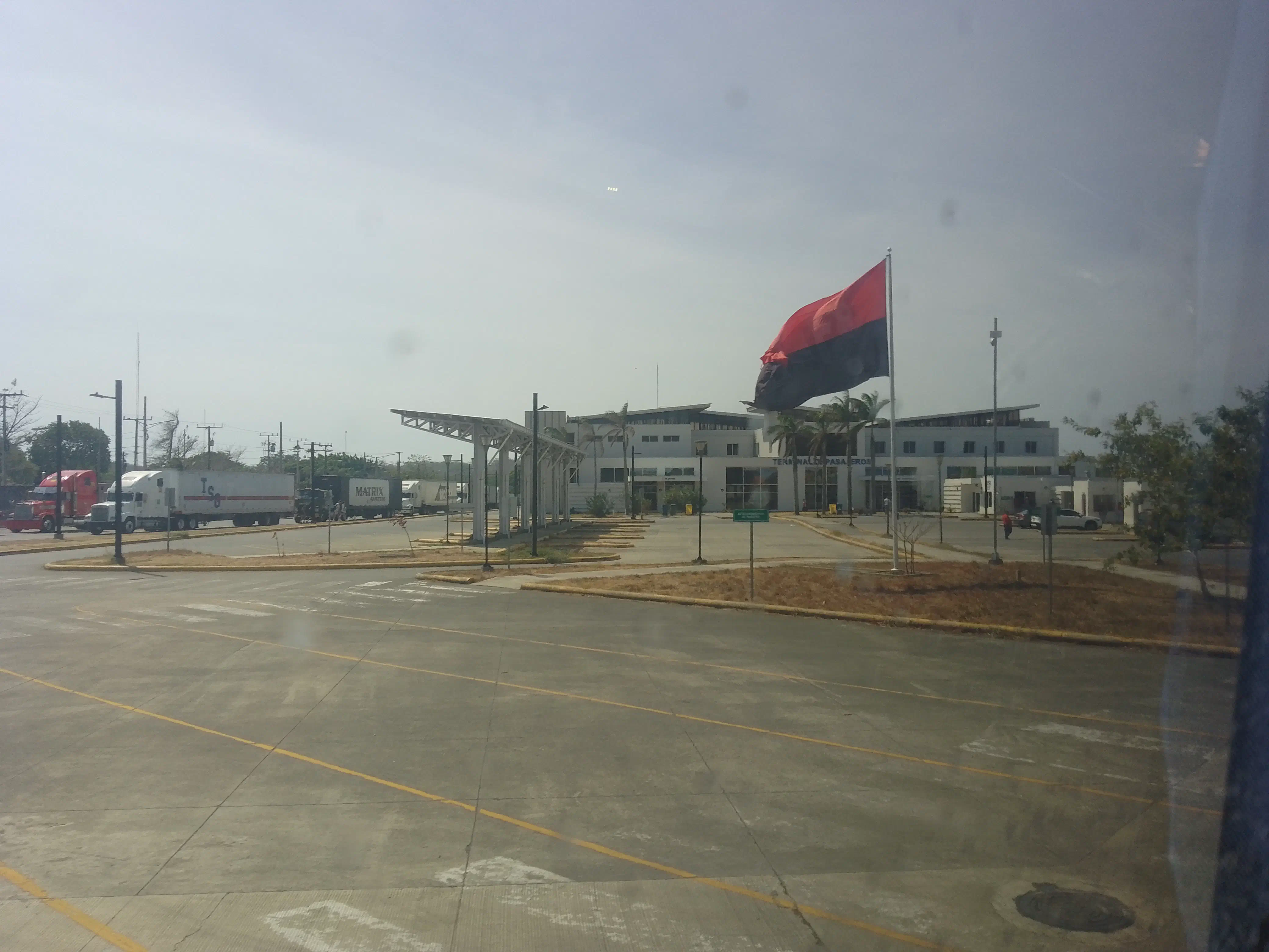 Nicaraguan border crossing, with a huge FSLN flag blowing in the wind