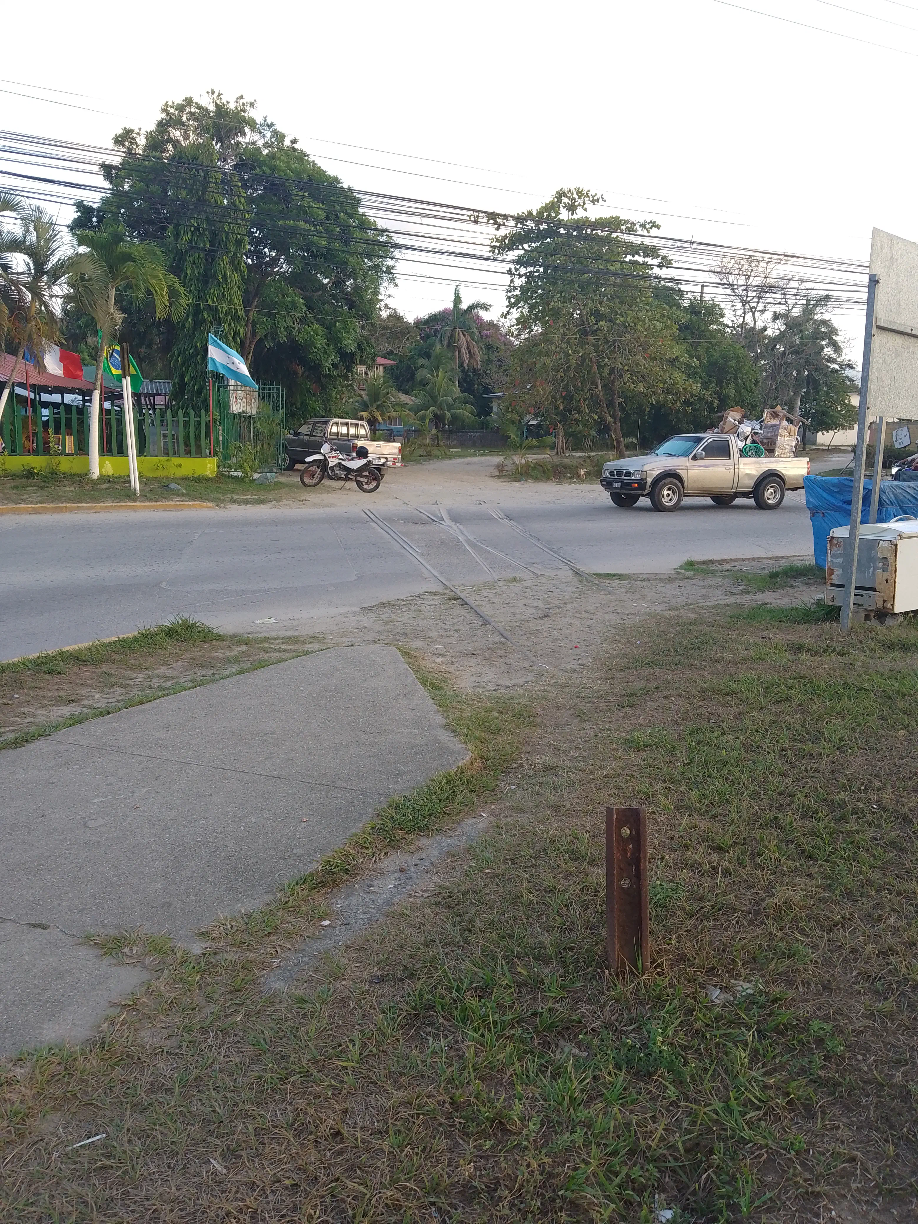 Remnants of railway track crossing a road