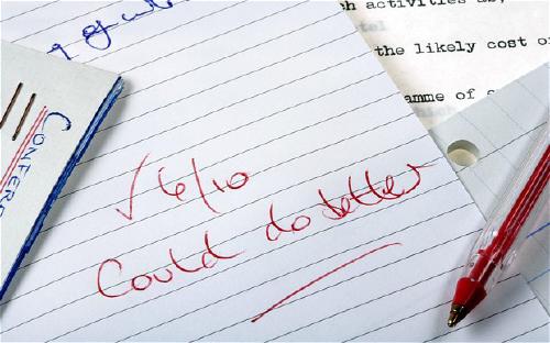 A notebook with '6/10 could do better' written in red ink