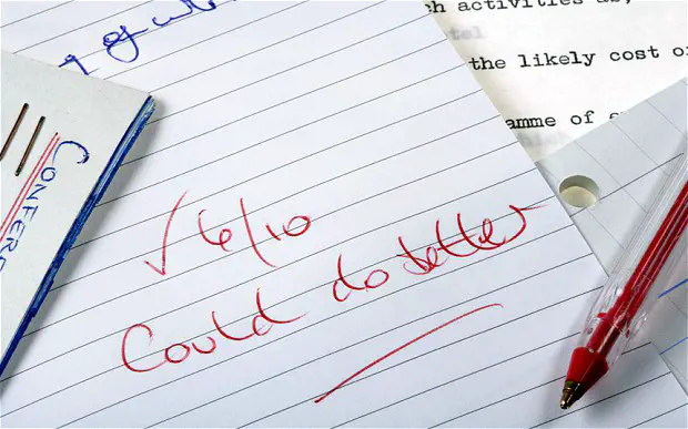 A notebook with '6/10 could do better' written in red ink