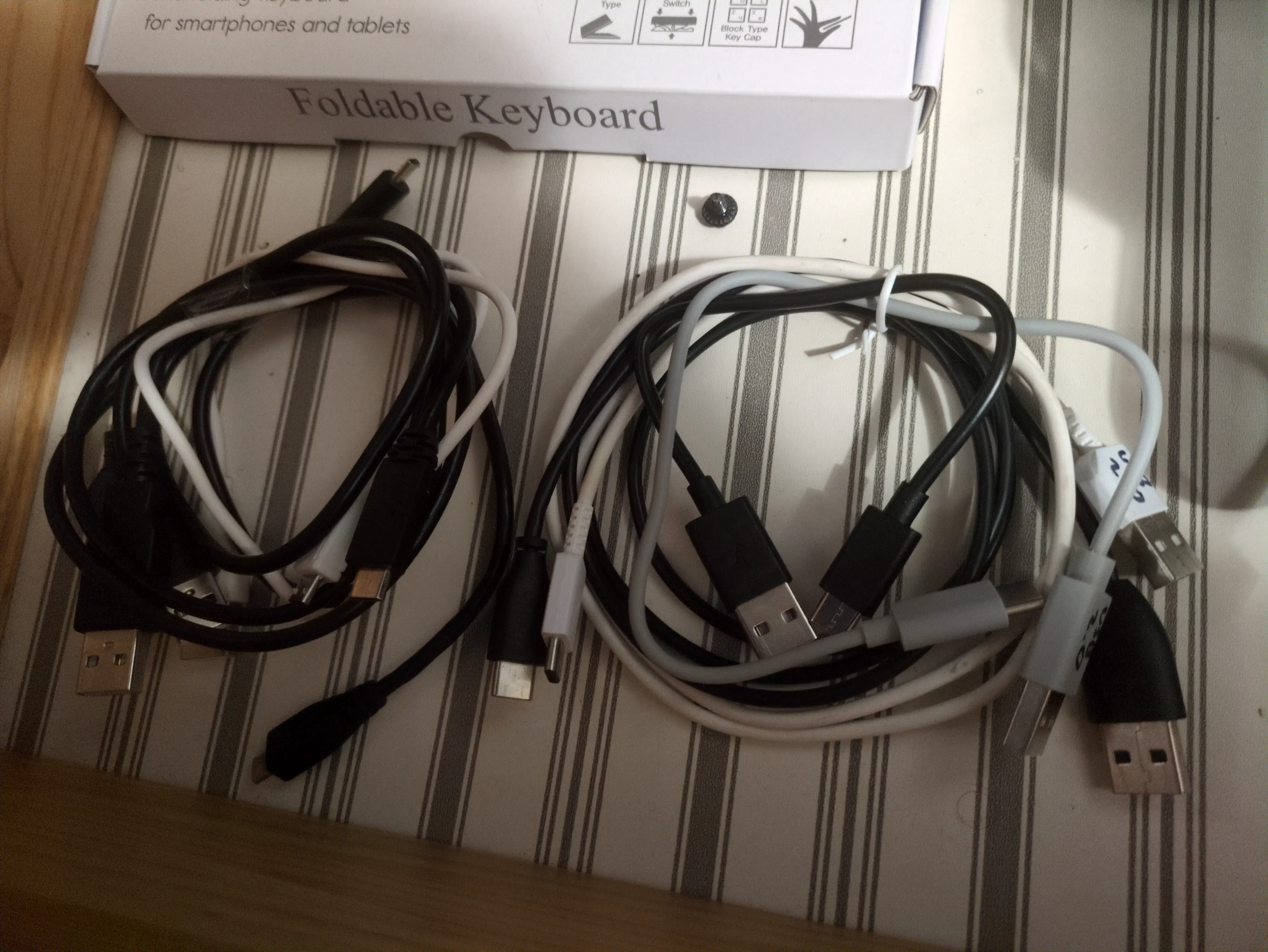 A collection of {{< abbr "usb" >}} cables in a drawer