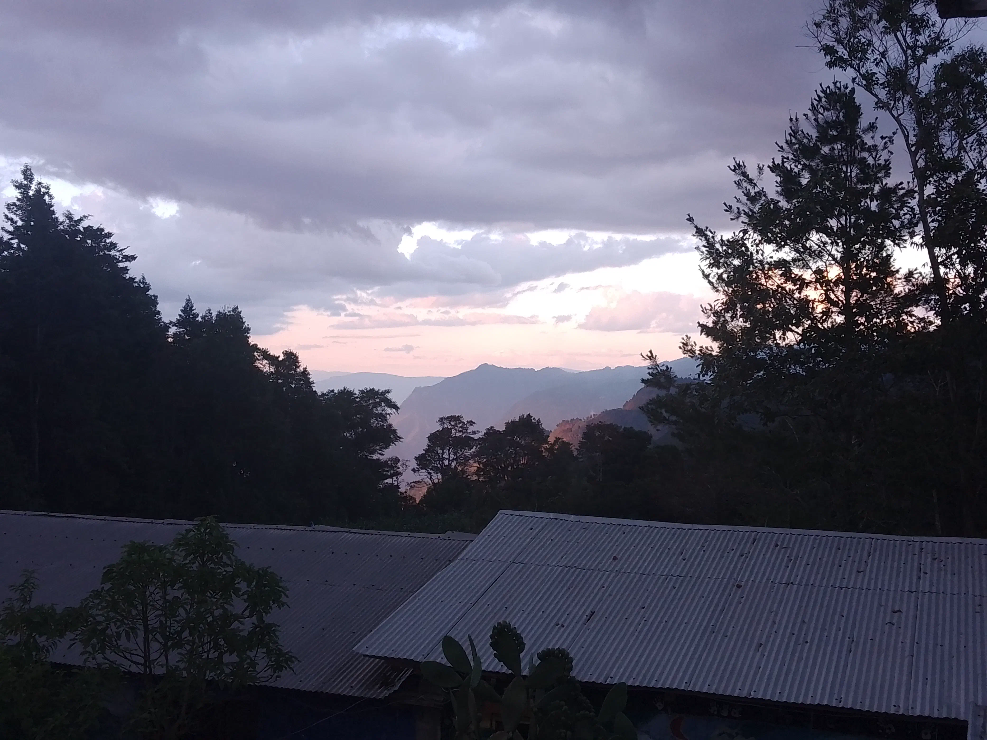 Sun setting on a mountain valley