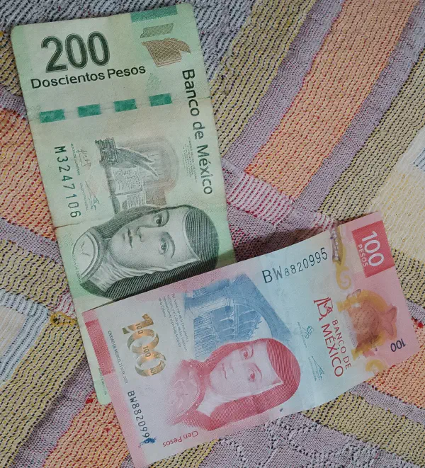 Two denominations of Mexican pesos