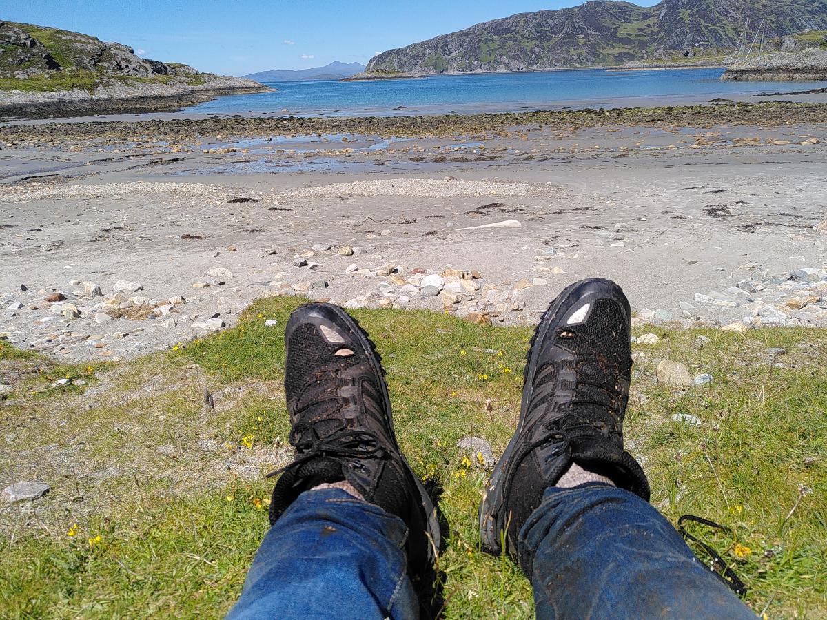 A picturesque bay in the background and my muddy boots in the foreground