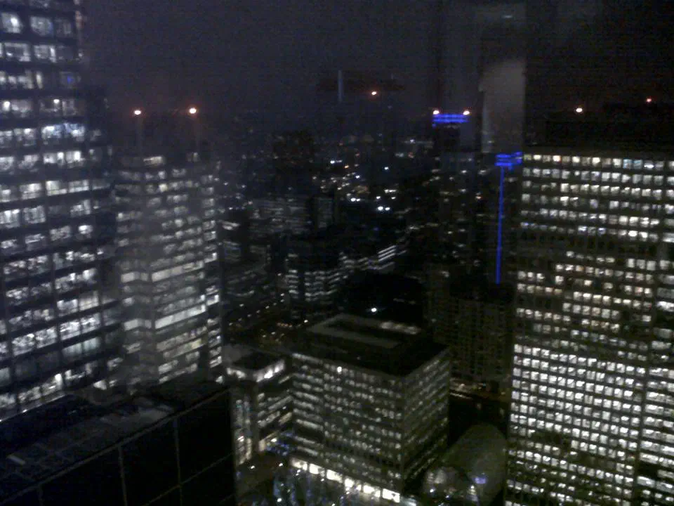 Canary Warf at night, viewed from a high skyscaper window