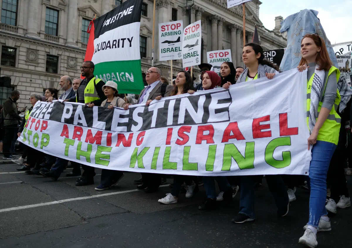 Palestine solidarity protesters march towards the British parliament on 5 June 2018.