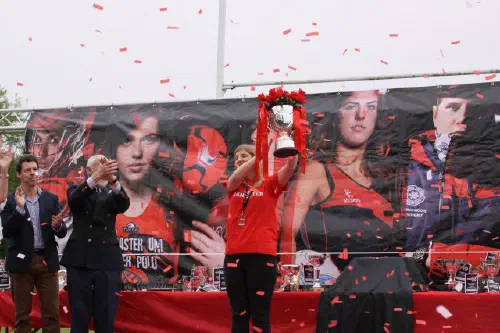 Person lifting a trophy