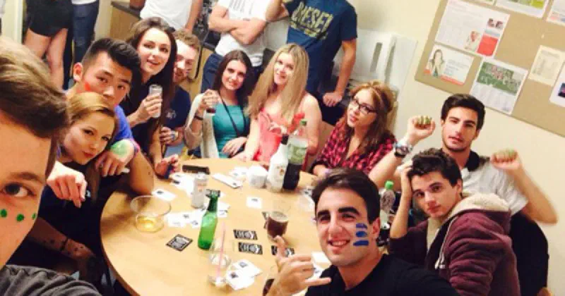 Students partying in a kitchen