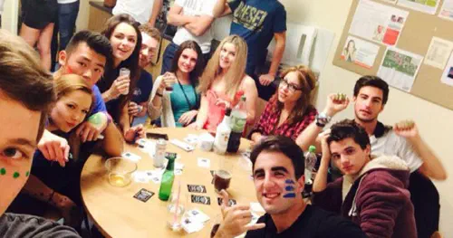 Students partying in a kitchen