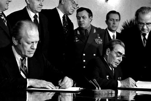 Gerald Ford and Leonid Brezhnev signing a document