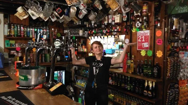 Woman behind the bar of a pub